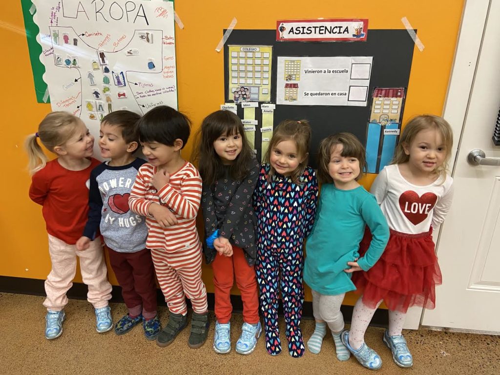 Casa student's celebrating Valentine's day and posing for a picture. 
