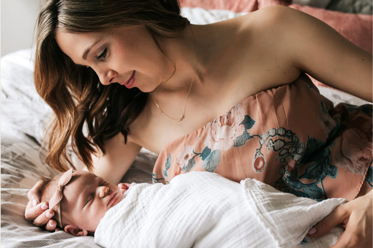 Featured parent Marissa holding her baby