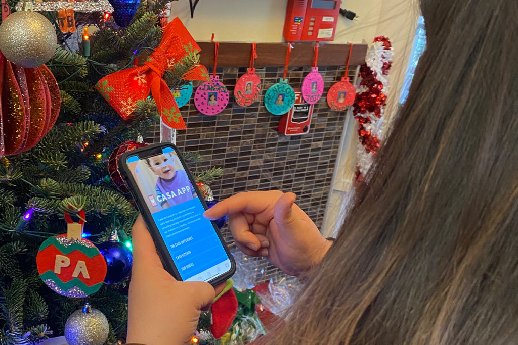 teacher showing the home screen of the Casa App.