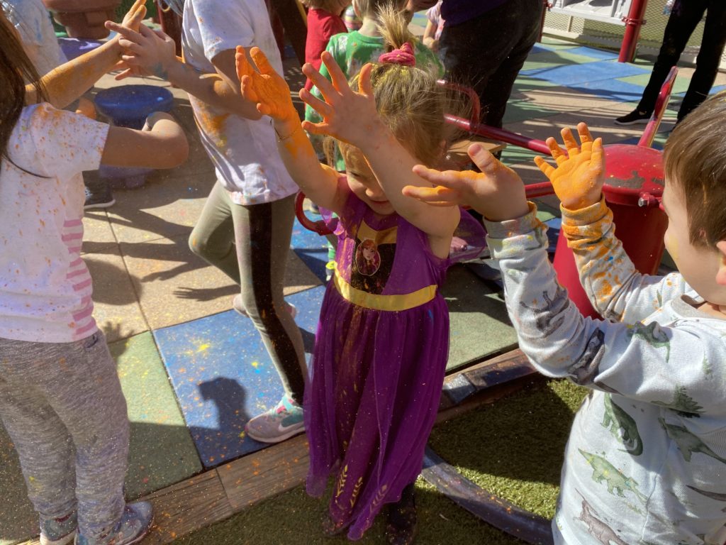 children at our casa daycare enjoy the holi festival celebration.