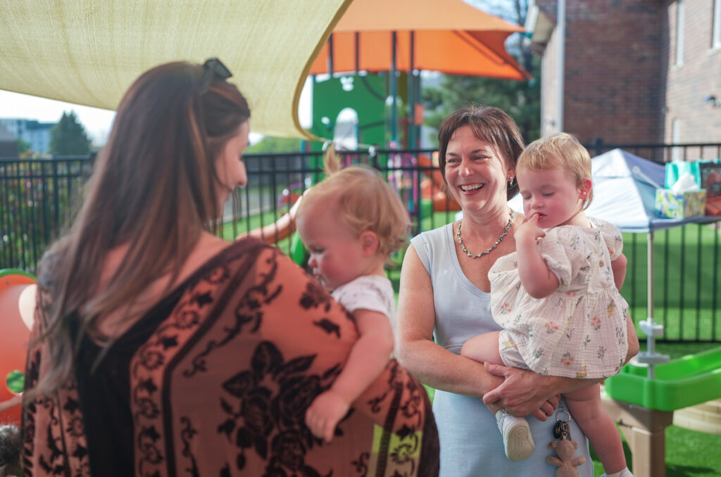 Bilingual families meeting for a play date to help improve their children's Spanish via immersion techniques.